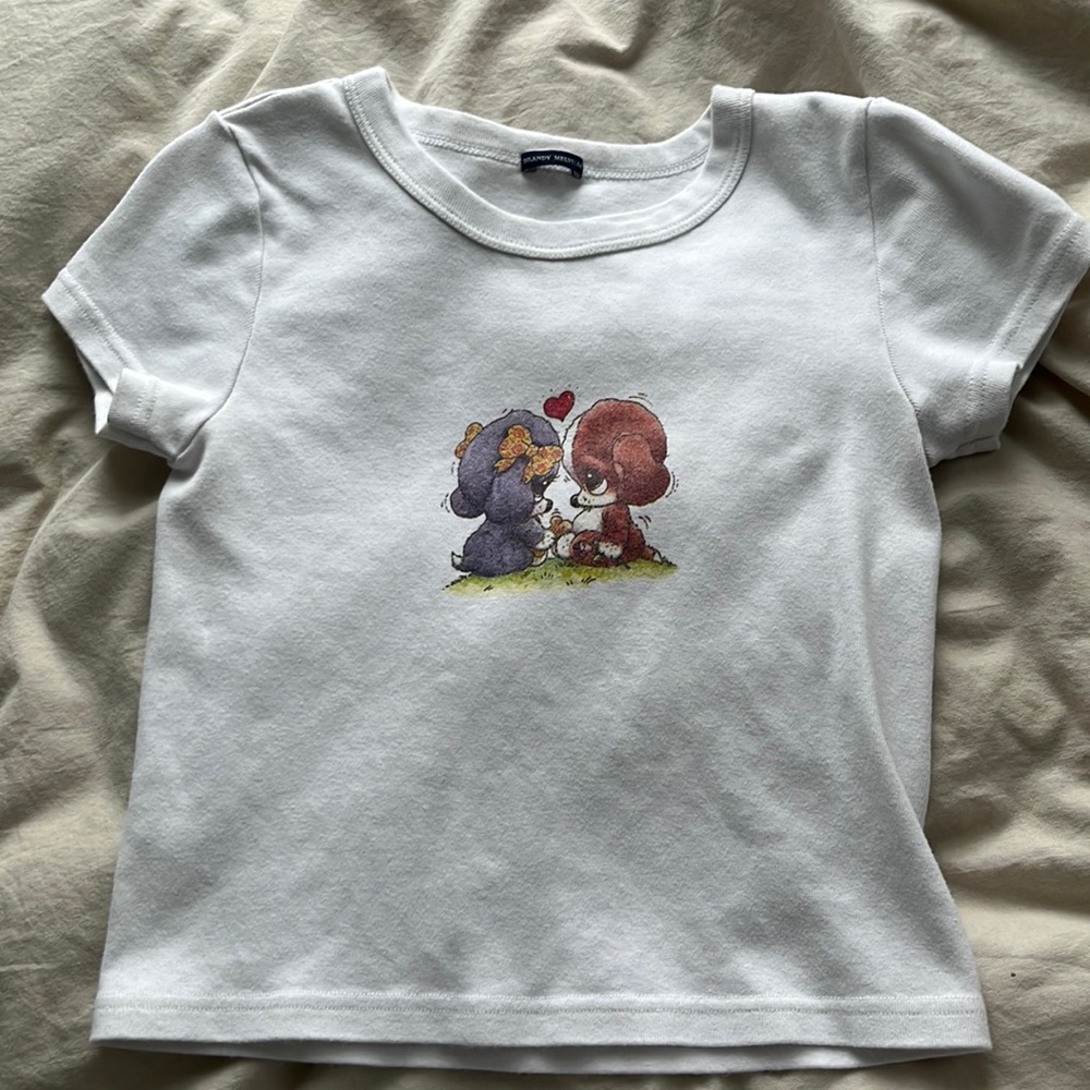 White baby tee with puppy dogs.